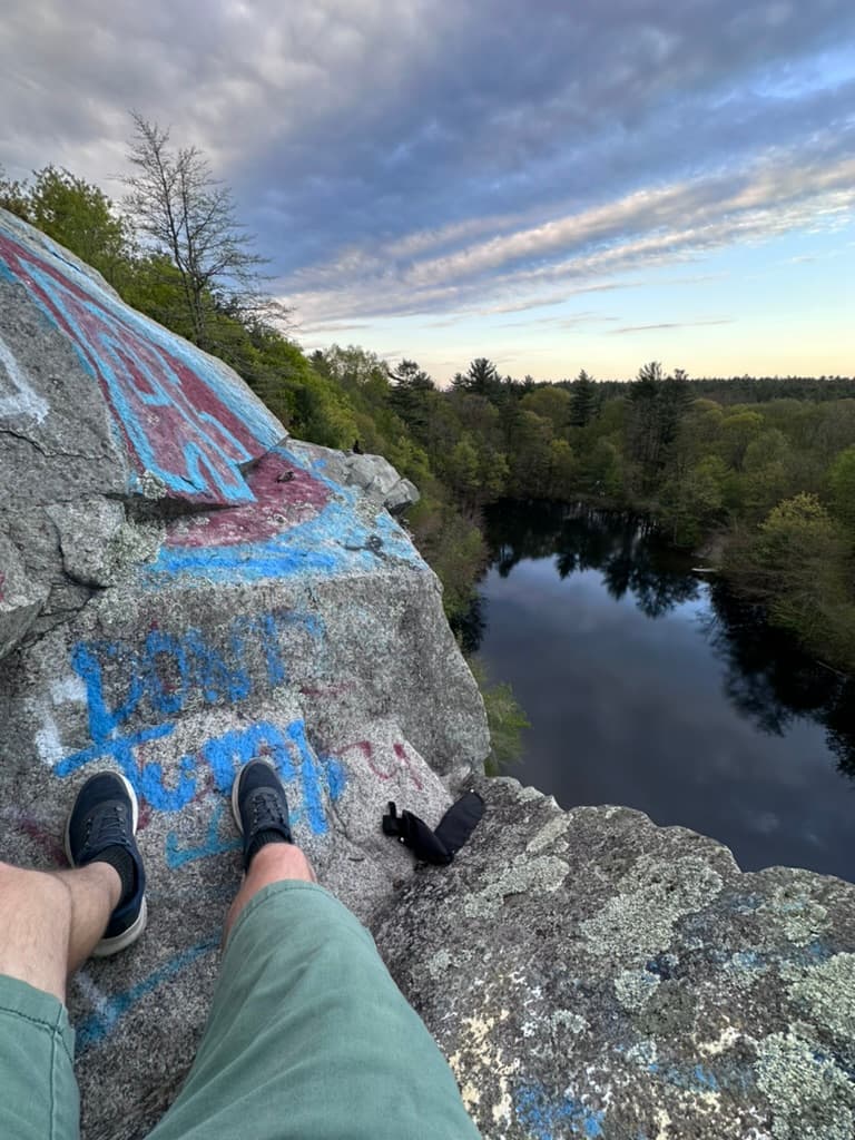 Sitting on a rock ledge overlooking a former quarry