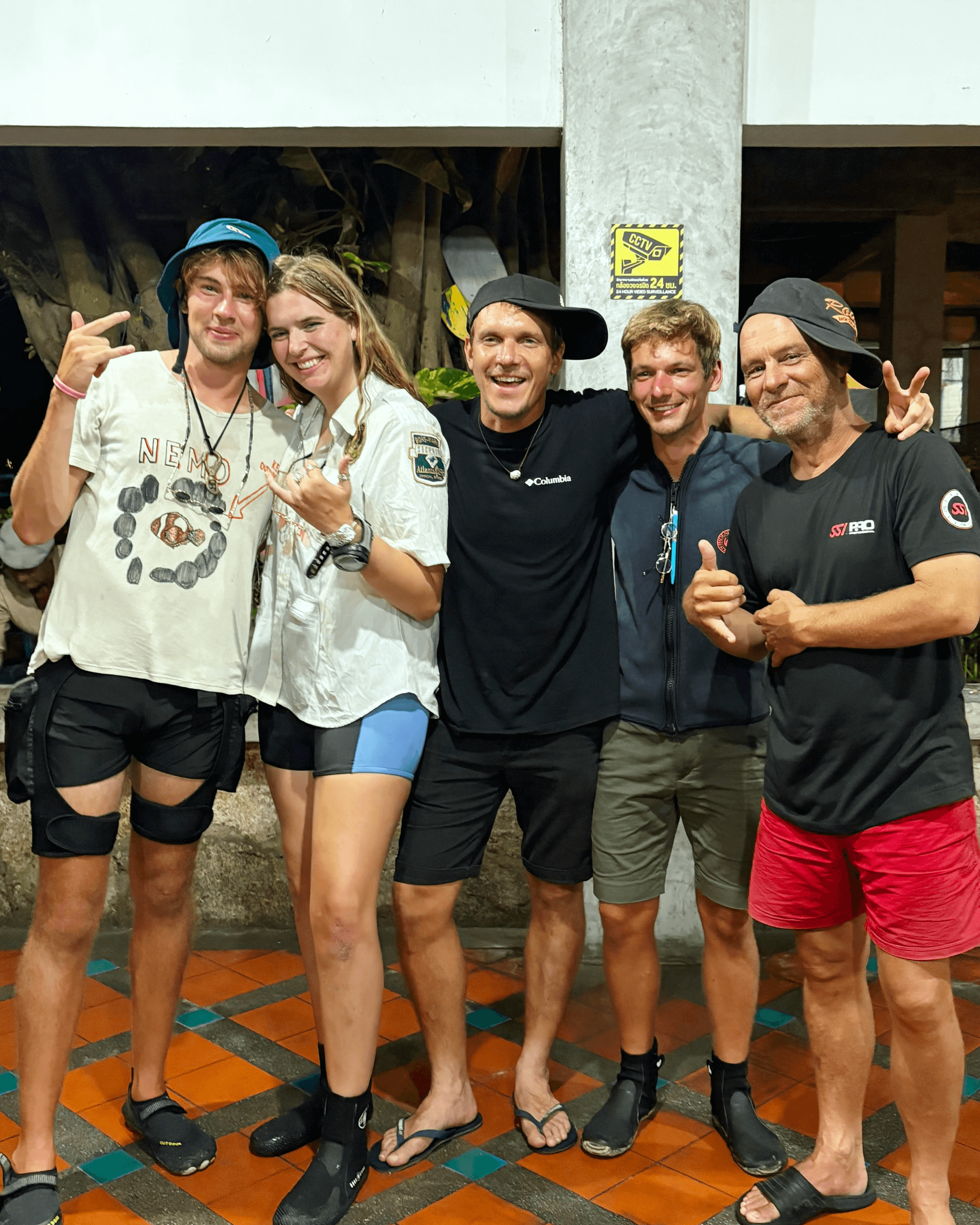 New divemasters Luke, Jojo, and Matthew with instructors Rory and Steve at Phoenix Divers Koh Tao