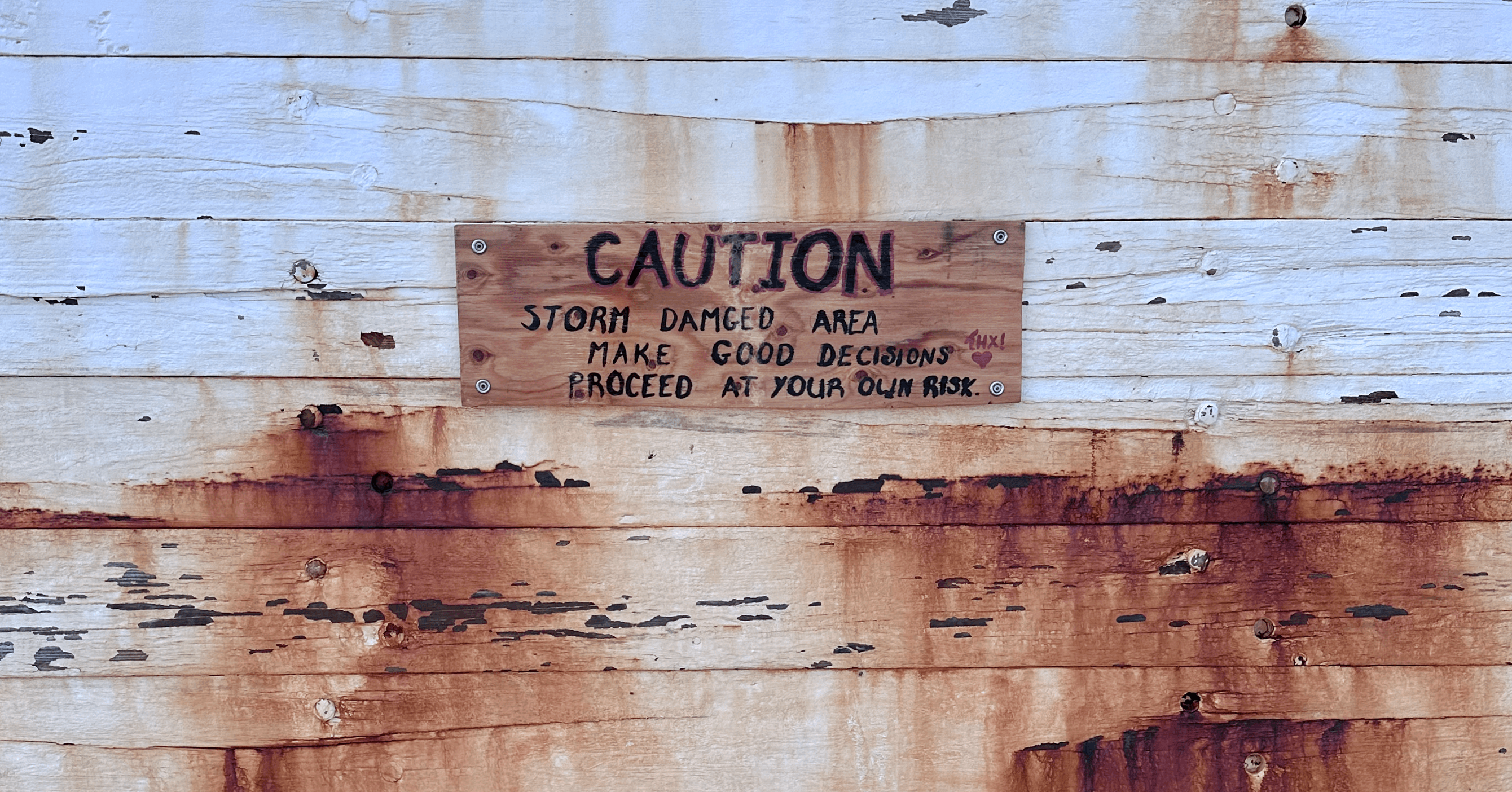 Caution sign on a Rockland, Maine lighthouse wall