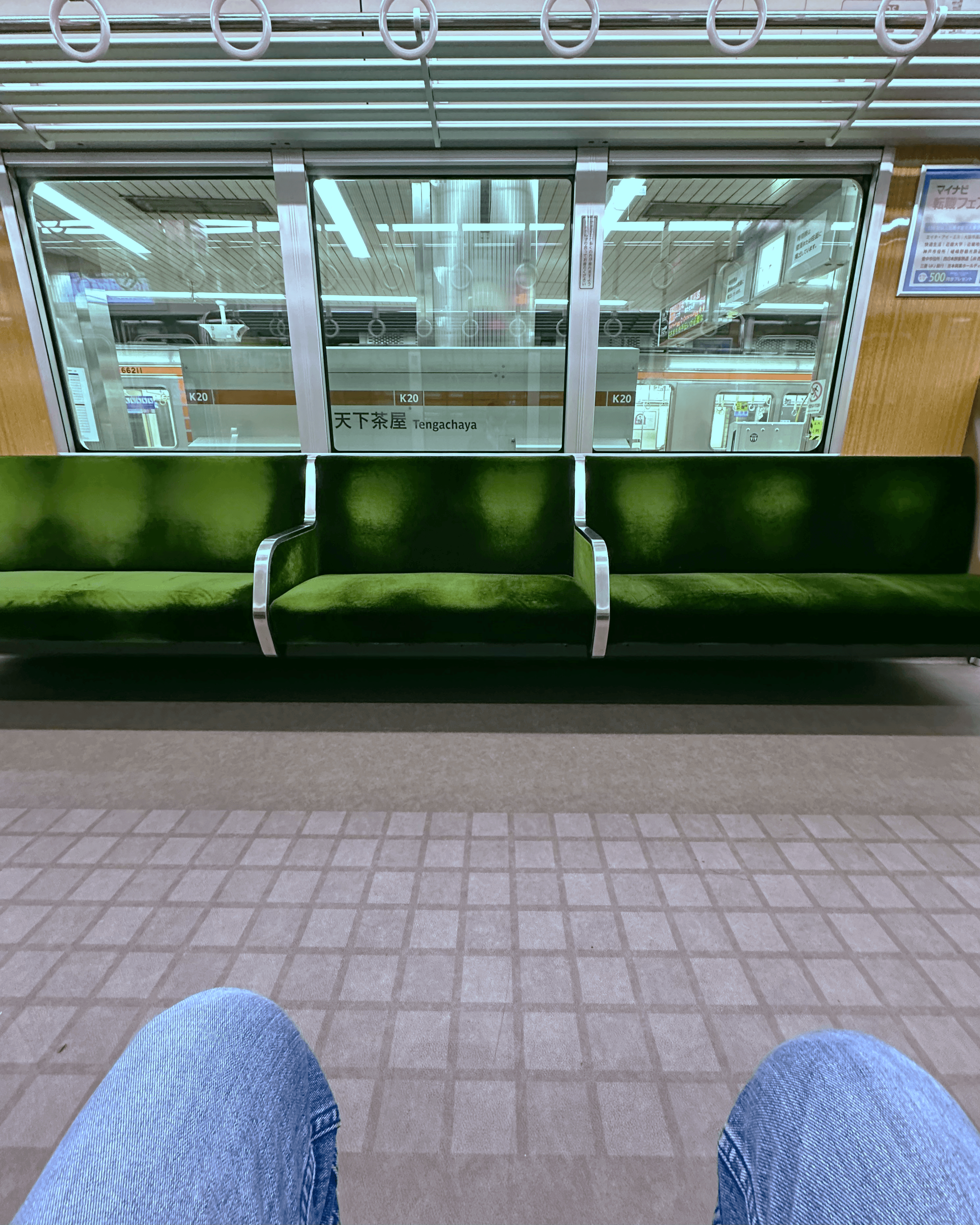 Sitting on an empty train at Tengachaya station in Osaka, Japan