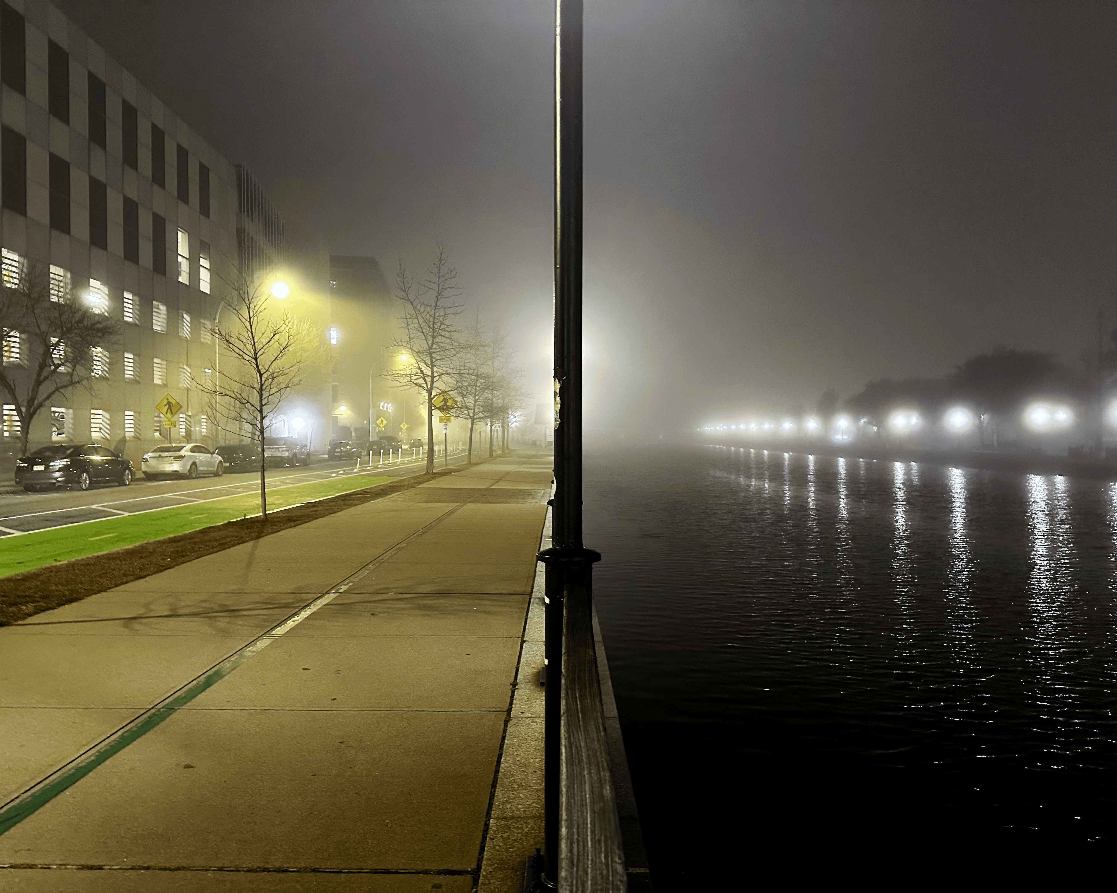 River in Providence Rhode Island split by a lamppost between bright and dark