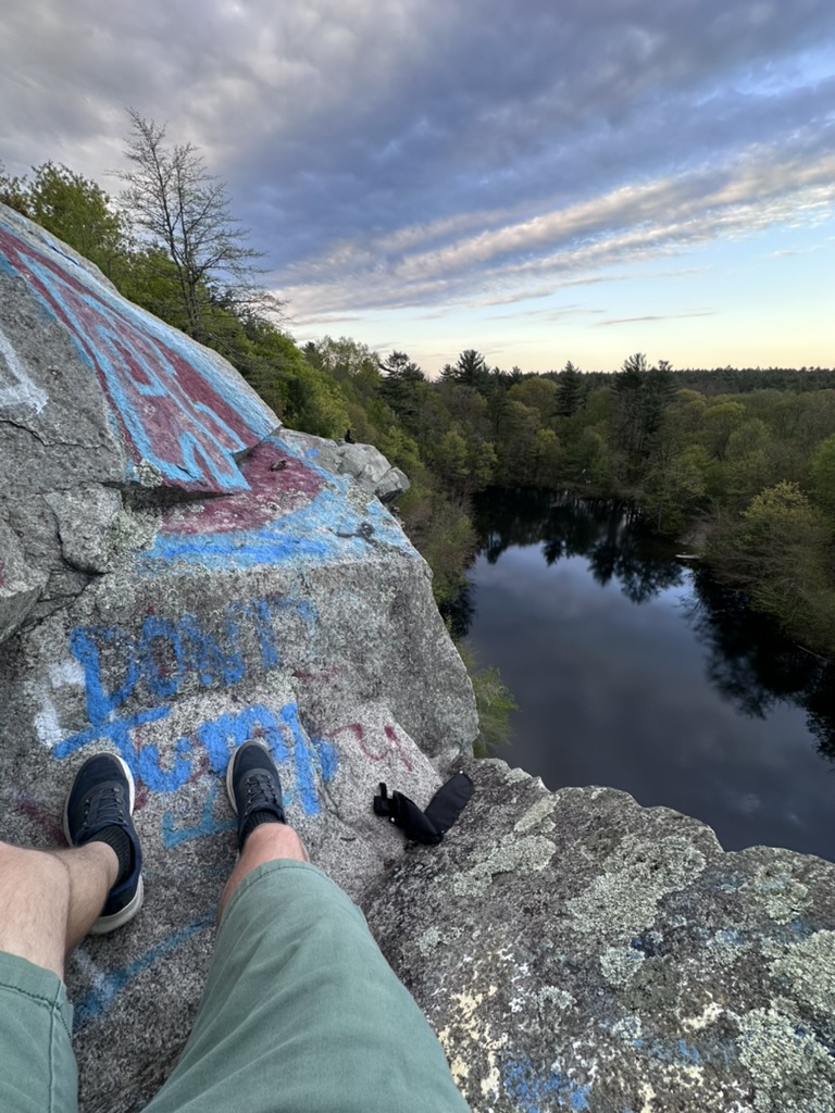 Sitting on a rock ledge overlooking a former quarry